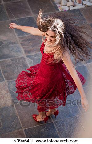 Woman in gown spinning outdoors View Large Photo Image Stock Image - Woman in gown spinning outdoors. Fotosearch
