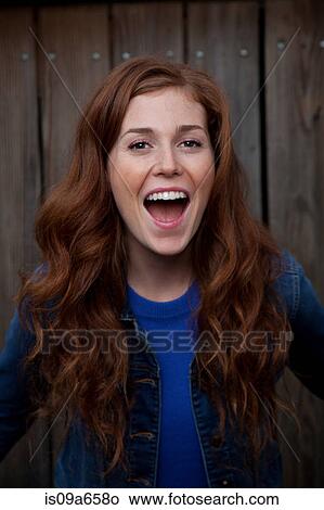 Picture - Woman laughing outdoors. Fotosearch