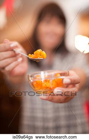 Woman offering spoonful of preserves View Large Photo Image Stock Photograph - Woman offering spoonful of preserves. Fotosearch