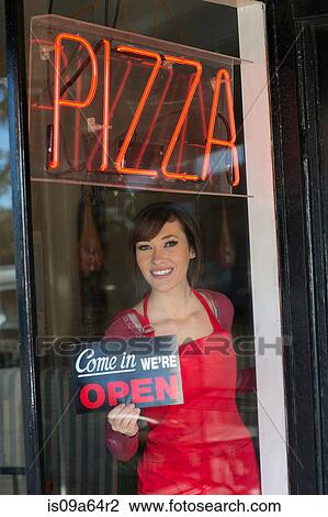 Woman putting open sign in window View Large Photo Image Stock Image - Woman putting open sign in window. Fotosearch