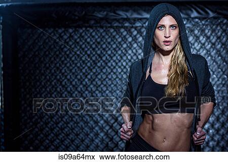 Woman wearing hoodie in gym View Large Photo Image Stock Photo - Woman wearing hoodie in gym. Fotosearch