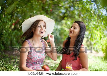 Women picnicking together in park View Large Photo Image Stock Image - Women picnicking together in park. Fotosearch