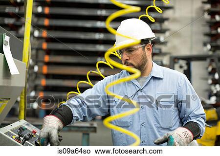 Worker at control panel in metal plant View Large Photo Image Picture - Worker at control panel in metal plant. Fotosearch