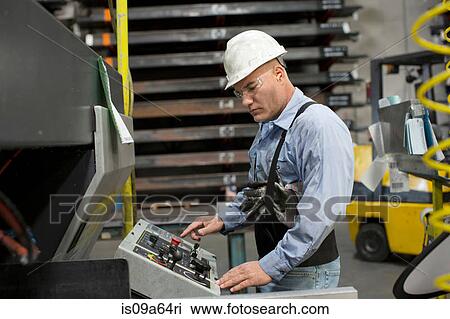 Worker at control panel in metal plant View Large Photo Image Stock Image - Worker at control panel in metal plant. Fotosearch