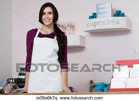 Baker smiling behind counter View Large Photo Image Stock Photography - Baker smiling behind counter. Fotosearch