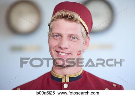 Bellhop smiling with kiss print on cheek View Large Photo Image Stock Photography - Bellhop smiling with kiss print on cheek. Fotosearch