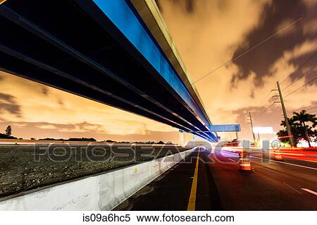Stock Photography - Blurred view of traffic on freeway. Fotosearch