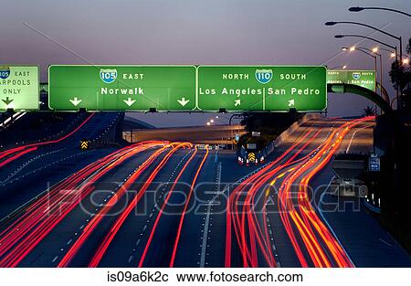 Stock Image - Blurred view of traffic on highway. Fotosearch