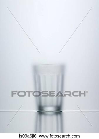 Blurred view of water glass View Large Photo Image Stock Photo - Blurred view of water glass. Fotosearch
