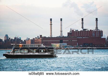Boat sailing in urban harbor View Large Photo Image Stock Photography - Boat sailing in urban harbor. Fotosearch