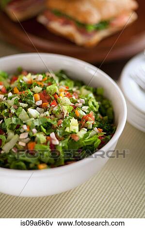 Stock Photo - Bowl of chopped salad on table. Fotosearch