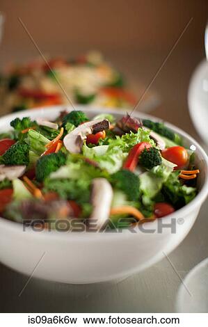 Bowl of chopped salad on table View Large Photo Image Stock Photo - Bowl of chopped salad on table. Fotosearch