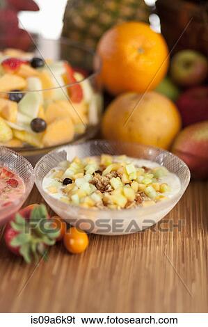 Bowl of fruit salad on table View Large Photo Image Stock Photograph - Bowl of fruit salad on table. Fotosearch