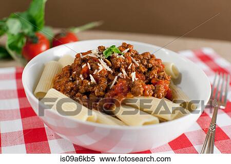Bowl of pasta on table View Large Photo Image Stock Photography - Bowl of pasta on table. Fotosearch