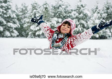 Stock Image - Boy playing in snow. Fotosearch