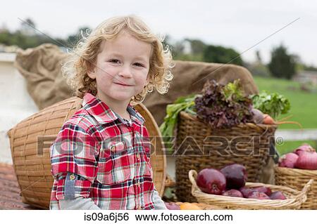 Boy with produce in truck bed View Large Photo Image Stock Photograph - Boy with produce in truck bed. Fotosearch