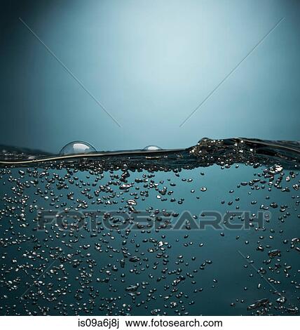 Stock Image - Bubbles floating in water. Fotosearch