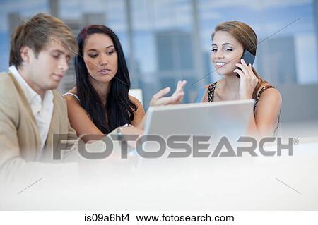Business people talking at desk View Large Photo Image Picture - Business people talking at desk. Fotosearch