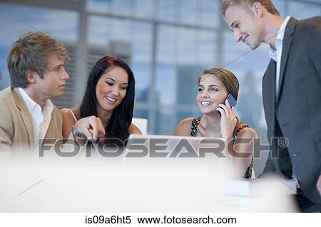 Business people talking at desk View Large Photo Image Stock Photography - Business people talking at desk. Fotosearch