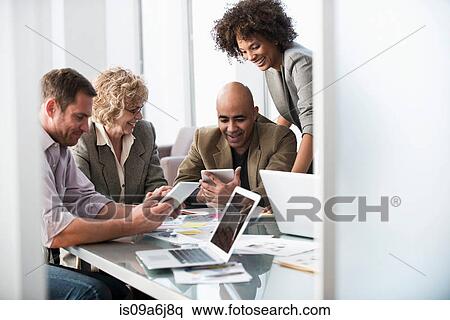 Stock Photography - Business people talking in meeting. Fotosearch