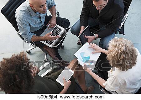 Business people talking in office View Large Photo Image Picture - Business people talking in office. Fotosearch