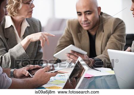 Business people working in meeting View Large Photo Image Picture - Business people working in meeting. Fotosearch