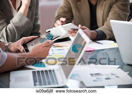 Business people working in meeting View Large Photo Image Stock Image - Business people working in meeting. Fotosearch