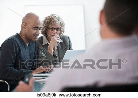 Business people working in meeting View Large Photo Image Stock Image - Business people working in meeting. Fotosearch