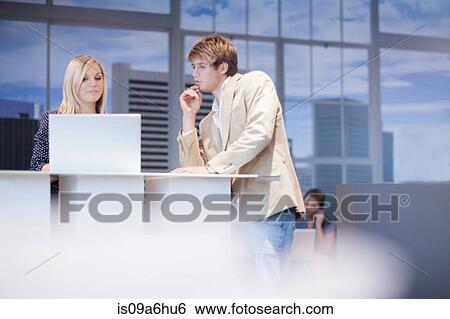 Business people working on laptop View Large Photo Image Stock Photograph - Business people working on laptop. Fotosearch