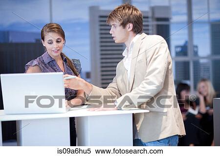 Business people working on laptop View Large Photo Image Stock Photography - Business people working on laptop. Fotosearch