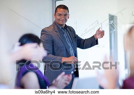 Picture - Businessman making graph on glass. Fotosearch