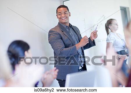 Businessman making graph on glass View Large Photo Image Stock Image - Businessman making graph on glass. Fotosearch
