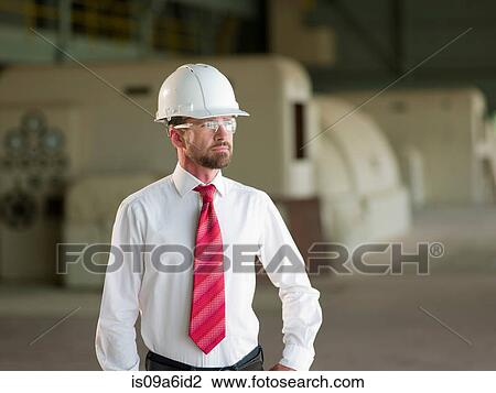 Stock Image - Businessman standing on site. Fotosearch