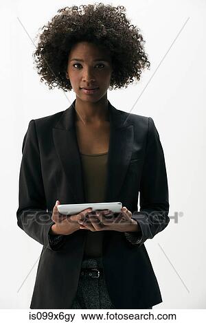 Businesswoman holding digital tablet View Large Photo Image Stock Photo - Businesswoman holding digital tablet. Fotosearch