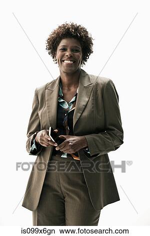 Picture - Businesswoman holding smartphone. Fotosearch