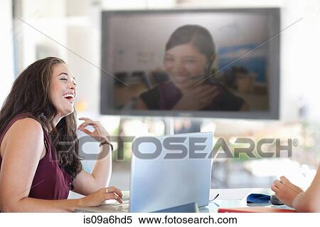 Businesswoman laughing in meeting View Large Photo Image Stock Photography - Businesswoman laughing in meeting. Fotosearch