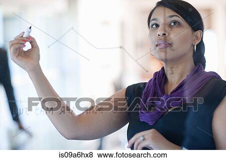 Businesswoman making graph on class View Large Photo Image Stock Photo - Businesswoman making graph on class. Fotosearch