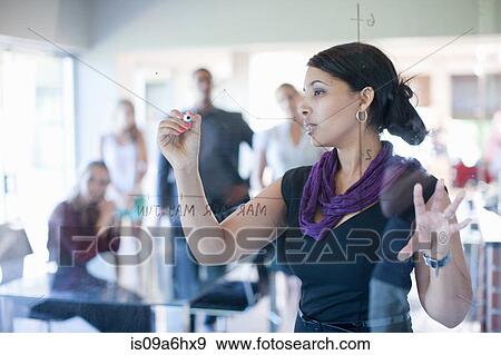 Stock Photo - Businesswoman making graph on class. Fotosearch