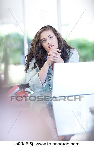 Businesswoman talking at desk View Large Photo Image Stock Image - Businesswoman talking at desk. Fotosearch