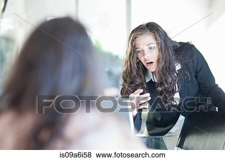 Businesswoman using laptop at desk View Large Photo Image Stock Photo - Businesswoman using laptop at desk. Fotosearch