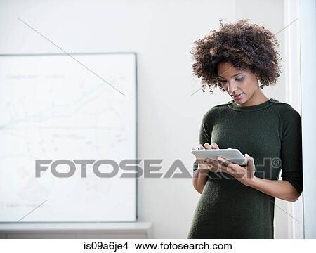 Picture - Businesswoman using tablet computer. Fotosearch