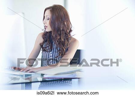 Businesswoman working on computer View Large Photo Image Stock Image - Businesswoman working on computer. Fotosearch