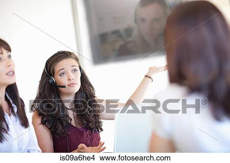 Businesswomen talking in meeting View Large Photo Image Picture - Businesswomen talking in meeting. Fotosearch