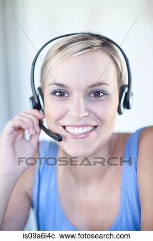 Businesswomen wearing headset View Large Photo Image Stock Image - Businesswomen wearing headset. Fotosearch
