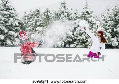 Stock Image - Children playing in snow. Fotosearch
