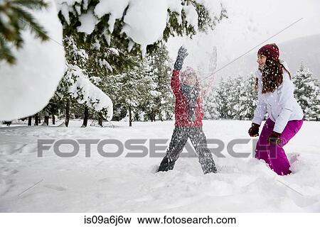 Stock Photo - Children playing in snow. Fotosearch