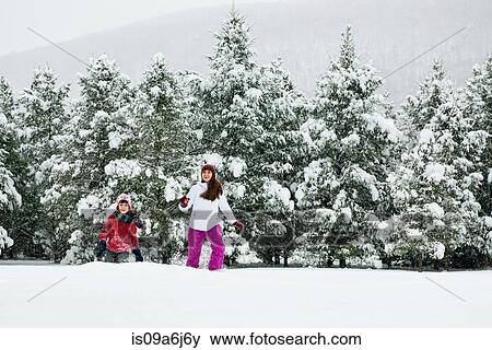 Children playing in snow View Large Photo Image Stock Photo - Children playing in snow. Fotosearch