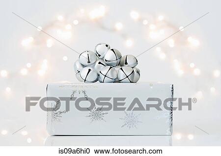Stock Image - Christmas gift and jingle bells. Fotosearch