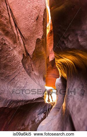 Stock Photography - Climber canyoning in Neon Canyon. Fotosearch