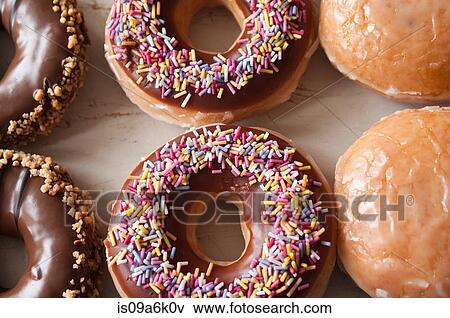 Close up of decorated doughnuts View Large Photo Image Stock Photo - Close up of decorated doughnuts. Fotosearch